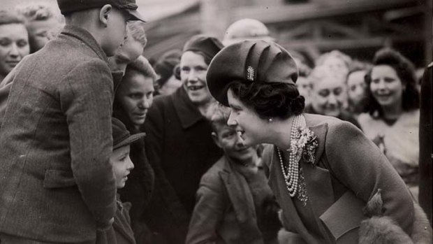 War time ... meeting the people on a visit to London's bombed East End in 1941.