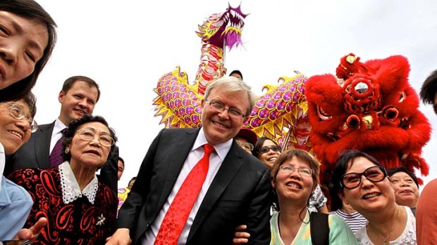 Declined ... Kevin Rudd chose not to appear at an event in Darling Harbour. Above, Mr Rudd surrounded by members of the Chinese community last week.