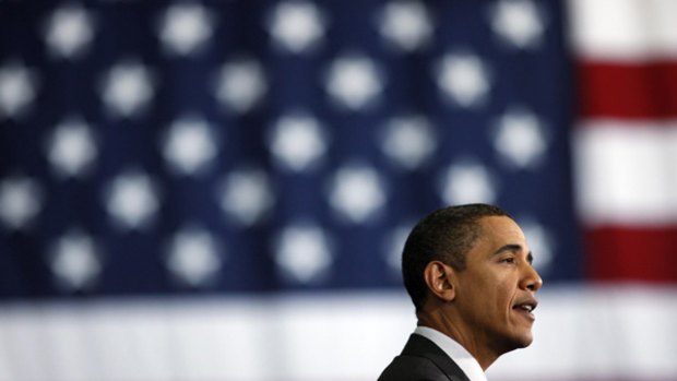 Year after historic election ... President Barack Obama speaks at Wright Middle school in Madison, Wisconsin.