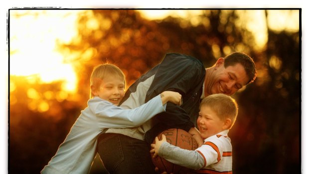 Brett Ratten plays with sons Cooper (left) and Tanner in 2007.