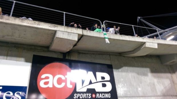 How could such a small scarf cause such a drama, hanging over the edge of the grandstand at Canberra Stadium.