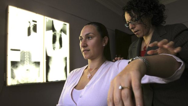 Therapy ... chiropractor Mary Papatheocharous treats Dimitra Saroukos at the Brighton Chiropractic Centre.