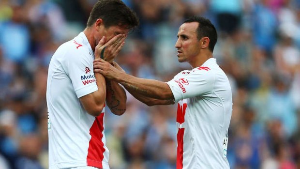 Bad luck continues: Harry Kewell, left, reacts with Michael Mifsud after missing a penalty kick.
