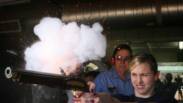 Taking aim: Libby Trickett fires a pistol on a swimming camp in 2007.