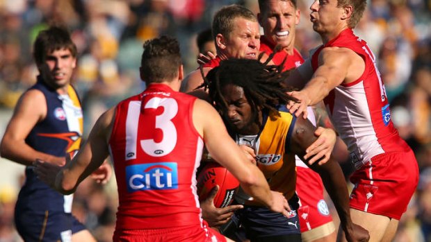 Nic Naitanui of the Eagles looks to break from a tackle during the match between the West Coast Eagles and the Sydney Swans at Patersons Stadium.
