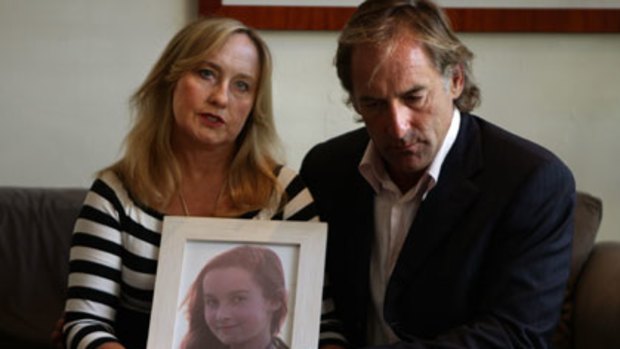 Donna and David Rankin hold a photograph of their daughter Shannon.