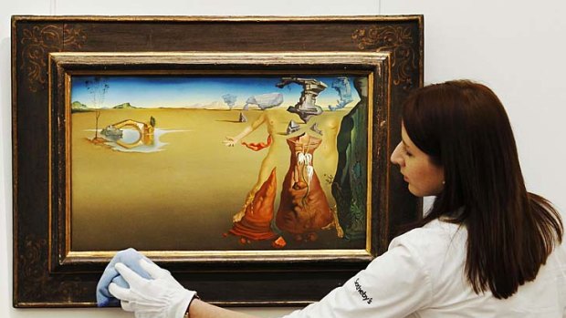 Salvador Dali's <i>Oasis</i> at Sotheby's auction house in London.