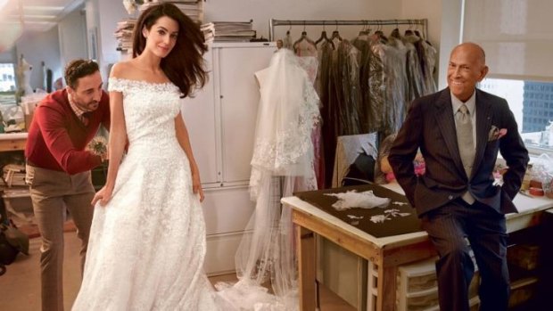 Amal Alamuddin photographed by Annie Leibovitz at her final dress fitting inside Oscar de la Renta's atelier in New York.