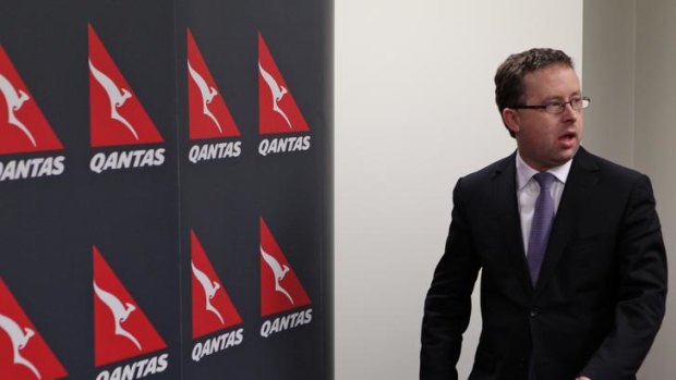 Qantas CEO Alan Joyce holds a media conference to announce the grounding of all flights.