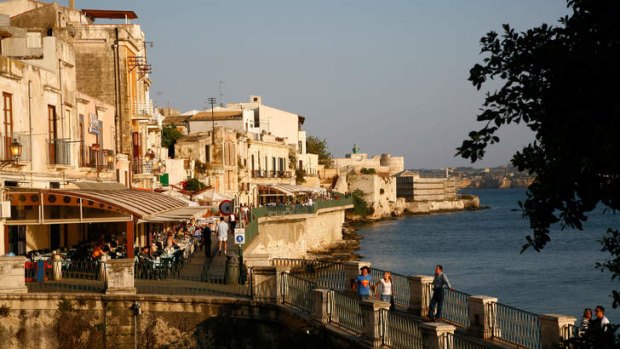 Seafront area with restaurants at the historical area of Ortygia Syracuse.