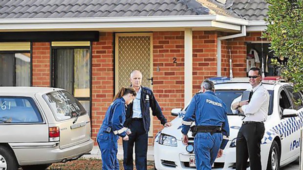 Police prepare to enter the home in Hadfield.