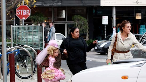 Eden Wood is rushed to a waiting car to avoid media after pulling out of the contest after her mother feared for her safety.