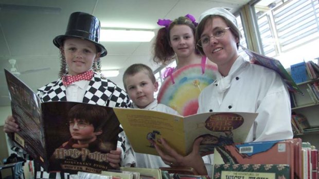 Book Week at the Teralba Public School ...  Logan Douglas, Mitchell Bailey and  Emilee Windle with librarian Louise Southward.
