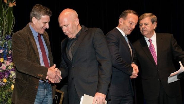 Joint fiction award winners, Steven Carroll (left) and Richard Flanagan, with the Prime Minister Tony Abbott and awards host Ray Martin.