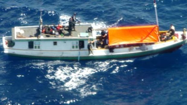 Final moments ... the vessel which was carrying more than 50 asylum seekers before it burst into flames near Ashmore Reed off the coast of Western Australia.