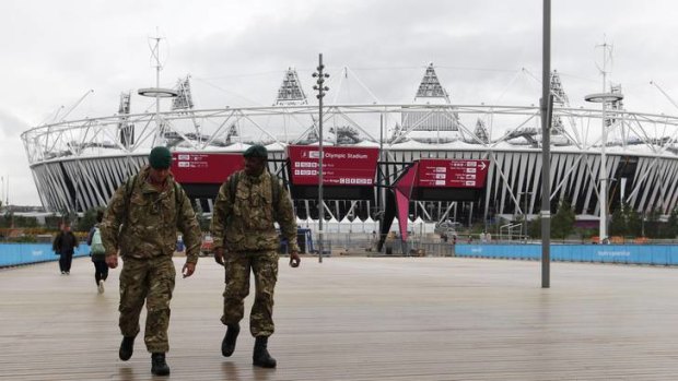Call in the troops ... two soldiers walk through the Olympic Park.