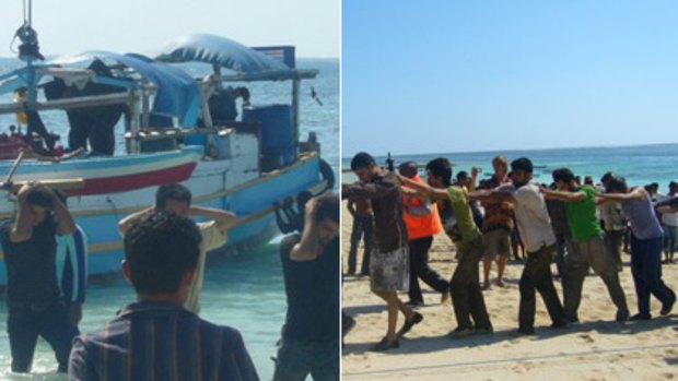 Still in Indonesia... the asylum seekers, believed to be Afghans, are taken off a boat and marched up a beach on Rote Island.