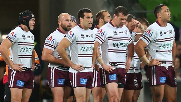 Dejected ... the Sea Eagles players were washed away by the Storm.