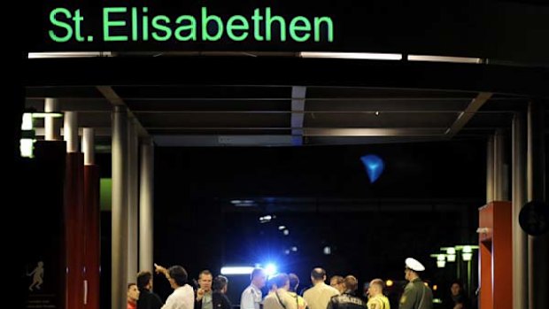 Police guard the entrance of the hospital in Loerrach.