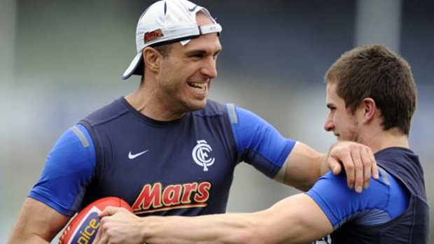 Chris Judd (left), the only Blue in the 40-man All-Australian squad enjoys a bit of push and shove with Marc Murphy, who has missed selection after a pre-season injury.