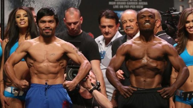 Manny Pacuiao and Timothy Bradley try not to be outdone by the other at the weigh-in.