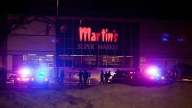 Police and emergency personnel respond to reports of a shooting inside Martin's Supermarket in Elkhart, Indiana.