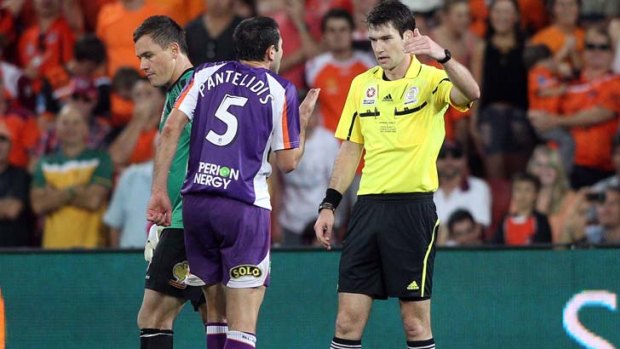Made up his mind ... referee Jarred Gillett tells Steve Pantelidis to move away from the penalty area.