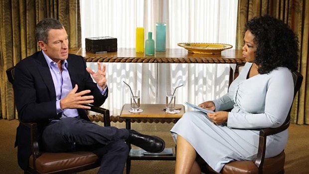 Oprah Winfrey speaks with Lance Armstrong.