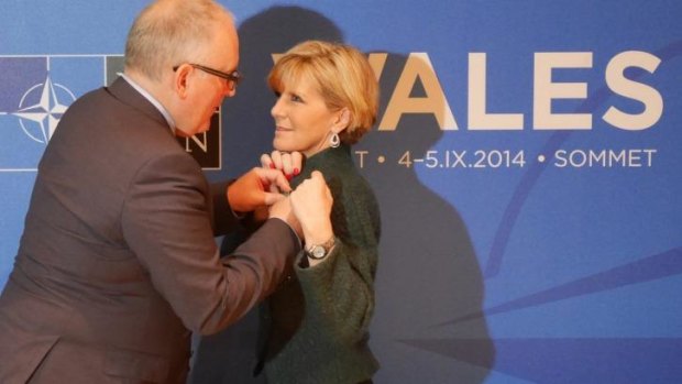Dutch Foreign Affairs Minister Frans Timmermans pins a medal on Australian Foreign Affairs Minister Julie Bishop at the NATO summit in September.