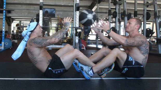 Throw it to me: Cronulla players Todd Carney (left) and Luke Lewis train on Thursday.