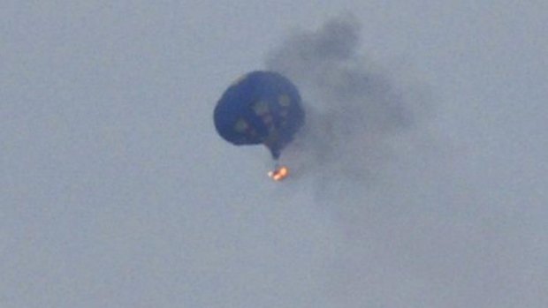 A hot air balloon hit a power line and caught fire over Virginia.