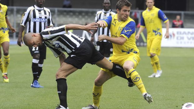 Recruit: Milos Dimitrijevic, right, seen here in action for Chievo in 2011, could be wearing the sky blue of Sydney FC on Saturday.