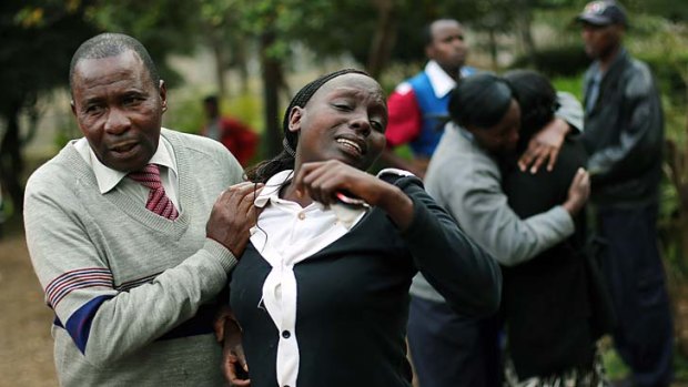 Grieving: Relatives of Johnny Mutinda Musango, 48, a victim of the siege, leave the city morgue in Nairobi after identifying his body.