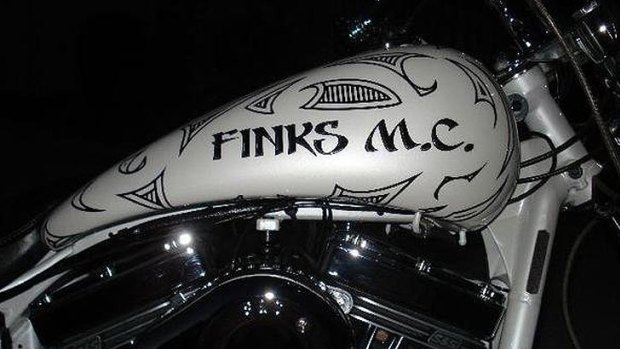 A motorcycle emblazoned with the Finks brand.