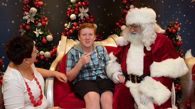 Protective environment: Nathan Beavan, 14, enjoys a visit to Santa at Rouse Hill Town Centre.