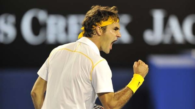 Made to work  ... Roger Federer celebrates during his win over Gilles Simon.