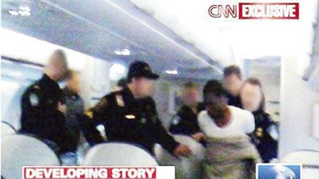 CNN Video still of terror suspect Umar Farouk Abdulmutallab being restrained by passengers and officials.