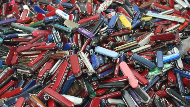 Piles of pocket knives confiscated by the US Transportation Security Administration. Airline passengers will be allowed to carry the items on board again from April 25.