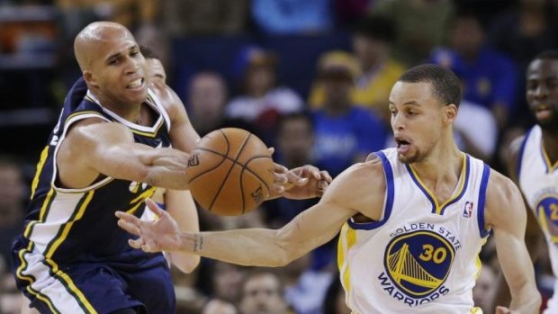 Golden State Warriors guard Stephen Curry strips the ball from Utah Jazz forward Richard Jefferson in Oakland.
