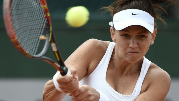 Bows out ... Australia's Casey Dellacqua hits a return to Czech Republic's Lucie Safarova during their French Open second round match.