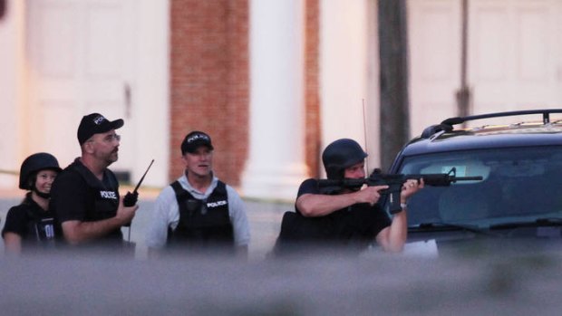 Back-up ... members of the police, FBI, Fire Department and Bomb Squad set up near the home of the alleged shooter of the Sikh Temple of Wisconsin.