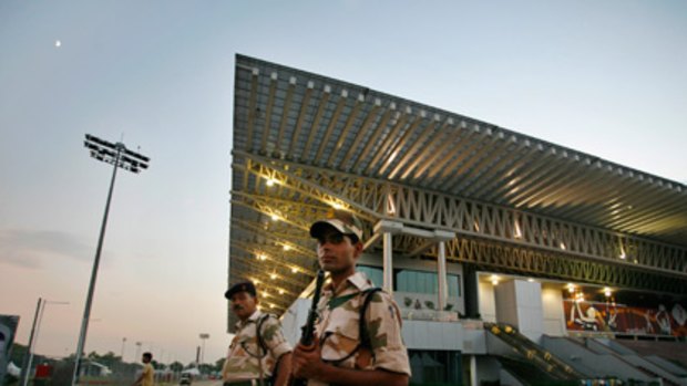 Indian paramilitary soldiers stand guard at the Thyagaraj Sports Complex, ahead of the Commonwealth Games, in New Delhi, India.