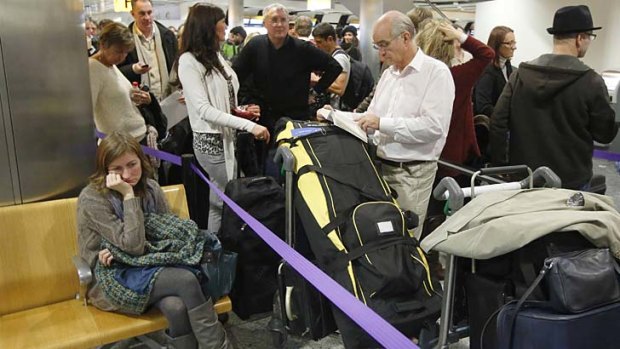 Passengers queue in Terminal 3 at Heathrow Airport in west during delays because of a technical problem at an air traffic control centre.
