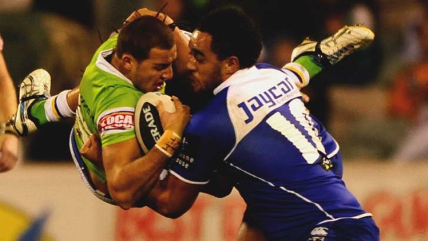 On the flip side ... Canberra's Blake Ferguson is tackled by Canterbury's Sam Kasiano.