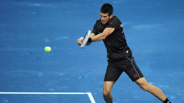 Hard hitting: Novak Djokovic in action against Daniel Jimeno-Traver at the Madrid Masters.