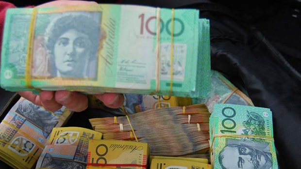 Cash haul ... police seized bundles of $100 and $50 notes.