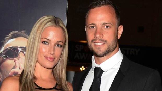 Oscar Pistorius (R) and his girlfriend Reeva Steenkamp pose for a picture in Johannesburg, February 7.