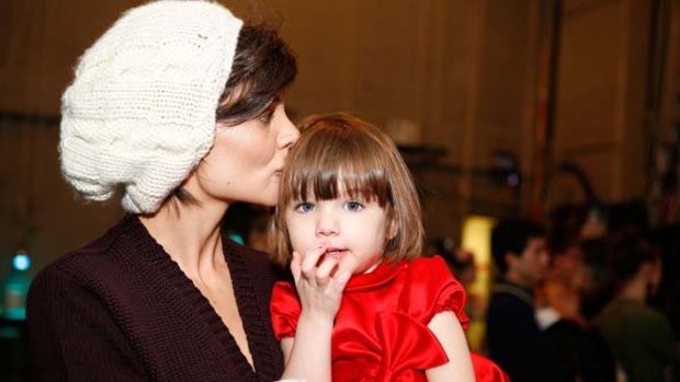 Fame . . . Katie Holmes with Suri.