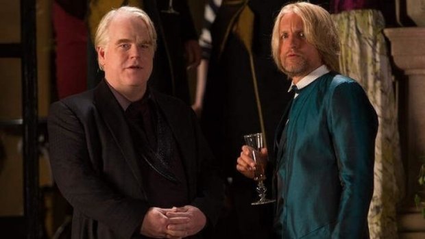 Unforgettable characters: The late Philip Seymour Hoffman (left) as Plutarch, and Woody Harrelson as Haymitch. 