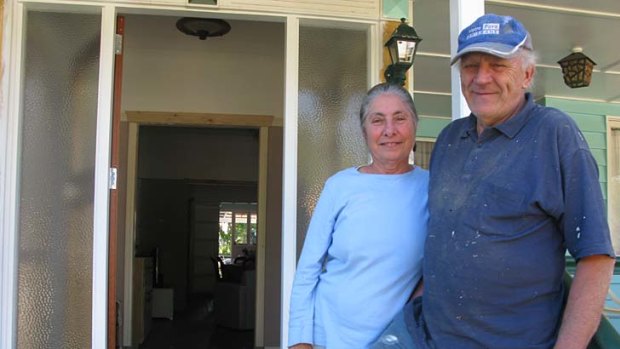Robert Assenberg and Magaret Gellel outside their flood damaged home.